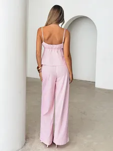 Back view of a chic pink striped crop cami top and matching wide-leg trousers set