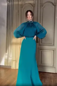 Elegant teal French style evening gown with puff sleeves and embellished collar detail