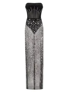 Elegant black strapless mesh evening gown with silver sequin detailing for red carpet.