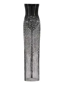 High-resolution detail of black strapless evening dress featuring a sequined mesh skirt