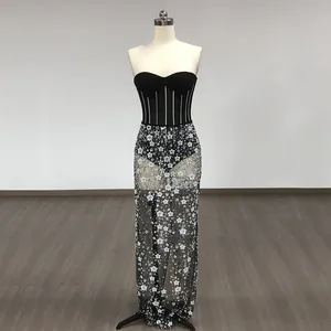 Detailed view of sexy black strapless corset top paired with a floral sequined mesh skirt