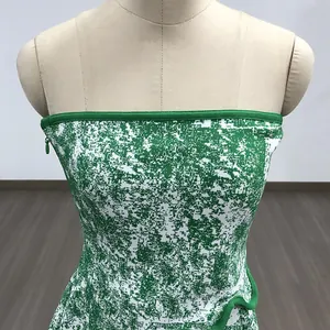 Detailed view of green and white jacquard tube top dress featuring side zipper closure