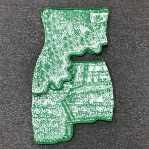 Two-piece green jacquard set with tube top and irregular mini skirt flat lay.