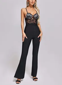 Full-length view of a black lace bandage jumpsuit with flared pants and corset bodice