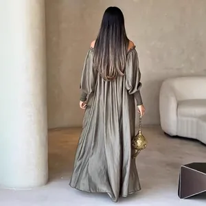 Elegant back view of shimmering off-shoulder maxi dress in metallic fabric
