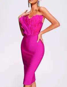 Detailed view of magenta strapless bandage dress with fluffy ostrich feather trim.