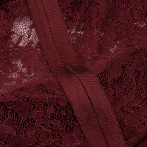Macro detail of burgundy floral lace fabric and ribbed bandage material for dress