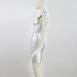 Detail side view of a shimmering silver metallic one shoulder bandage bodycon mini dress