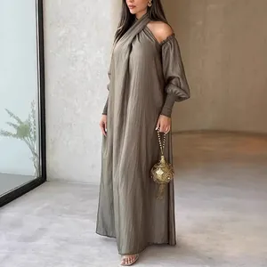 Elegant long sleeve maxi dress in textured gray fabric with halter neck