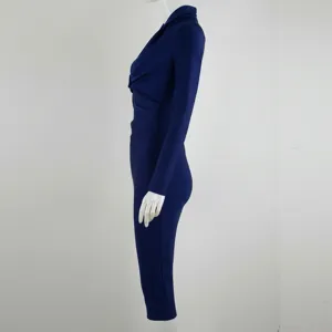 Detail side view of the navy blue long sleeve bandage dress showing the fitted silhouette
