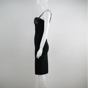 Side profile view of elegant black lace slip bandage dress on white mannequin display