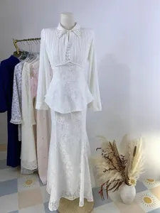 Elegant white lace and pleated chiffon long sleeve peplum set with a mermaid skirt design