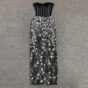 Detailed view of a sleeveless strapless gown with floral mesh skirt and sequin beading