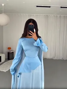 Elegant light blue long sleeve dress with asymmetrical chiffon hem and unique cape detail