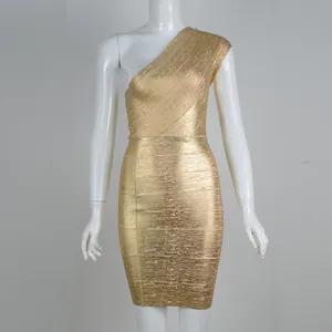 Macro view of gold foiled texture on a one-shoulder bandage bodycon party dress