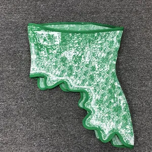 Detailed macro view of green and white jacquard fabric on irregular hem fashion mini skirt