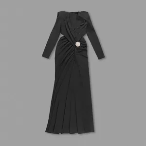 Elegant black V-neck long sleeve dress with side cutouts and gathered waist detail