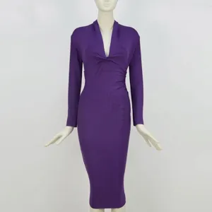 Front view of an elegant purple long-sleeved bandage dress featuring a sexy deep V-neckline