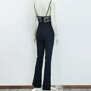 Back view of elegant black lace jumpsuit on mannequin showing detailed lace bodice and flare pants