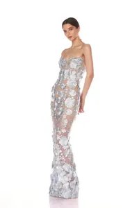 Detailed view of elegant 3D floral appliqués on light blue strapless evening gown.