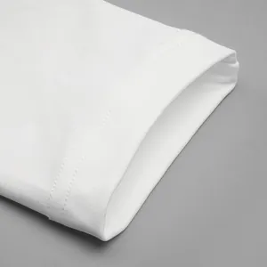 Close-up macro shot showing the fine double-stitched cuff detail of a white French dress