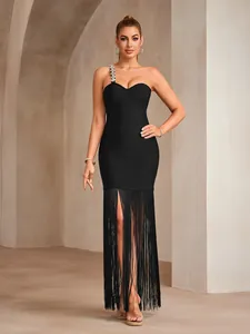 Detail of black one-shoulder bandage dress with rhinestone chain and long fringe tassels