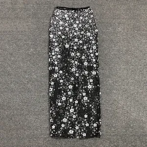 Detailed view of floral sequin embroidery on elegant mesh banquet evening gown