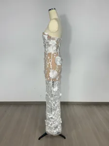 Elegant side view of white lace maxi dress with 3D floral appliqués and strapless design