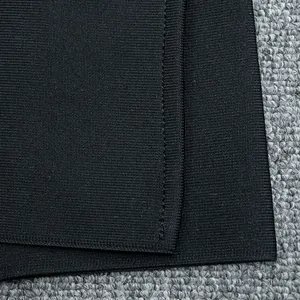 Macro view showing the high-quality stitching and elastic texture of this black jumpsuit
