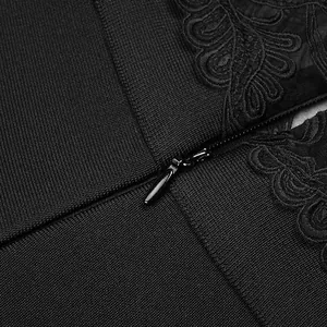 Detail shot of elegant black lace embroidery and hidden zipper on bandage jumpsuit