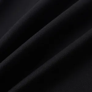 Close-up macro detail of the high-quality black bandage evening dress fabric texture
