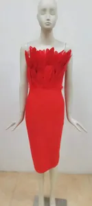 Detailed view of a Christmas red bandage midi dress with elegant ostrich feather tube top.