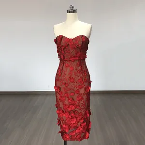 Elegant red midi dress with 3D floral lace appliques and strapless design on mannequin