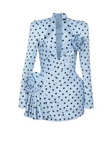 Detailed view of light blue polka dot dress with 3D floral and ruched design
