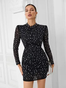 Close-up detail of the black mesh long sleeve bodycon dress with sparkling rhinestone decor