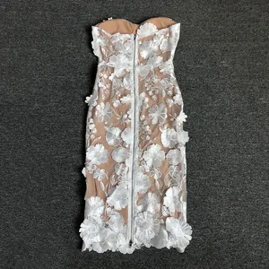 Back view detail of white lace strapless dress with 3D floral appliques and zipper