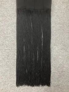 Close-up detail of dense black fringe on a elegant bandage cocktail party dress
