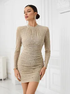 Detailed view of an elegant long-sleeve mesh mini dress featuring exquisite rhinestone embellishments