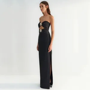 Elegant black strapless bandage maxi dress with rhinestone detailing and sun ornaments