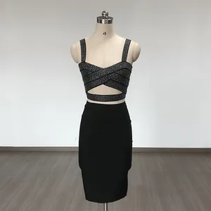 Detail view of black rhinestone bandage set featuring a crop top and pencil skirt.