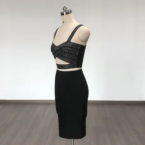 Side view of a sexy black bandage two-piece set with rhinestone embellished crop top.