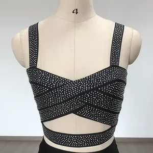 Close-up of a black bandage crop top with shimmering silver rhinestone embellishments