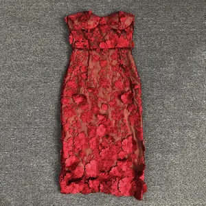 Close-up view of red 3D floral embroidery on an elegant strapless evening midi dress