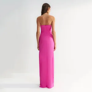 Back view of elegant hot pink strapless bandage long dress for formal evening occasions