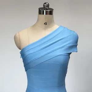 Close-up detail of a light blue one-shoulder bandage bodycon evening dress on a mannequin