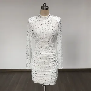 Detailed front view of white mesh long sleeve rhinestone bodycon mini dress on mannequin