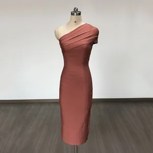 Elegant one-shoulder bodycon bandage evening dress in rose gold on a mannequin
