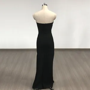 Detailed back view of an elegant black strapless bandage maxi dress displayed on a mannequin