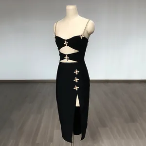 Elegant black bandage midi dress featuring rhinestone chain straps and high slit detail.