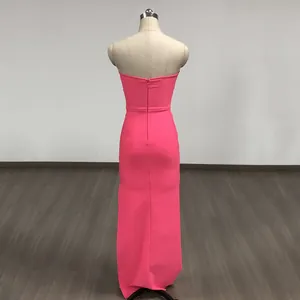 Back view of elegant fuchsia pink strapless bodycon maxi dress on mannequin.
